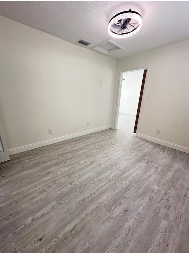 unfurnished room featuring light hardwood / wood-style flooring