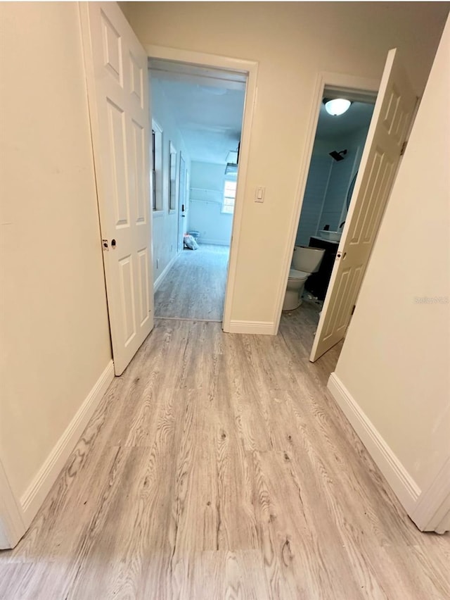 corridor featuring light wood-type flooring