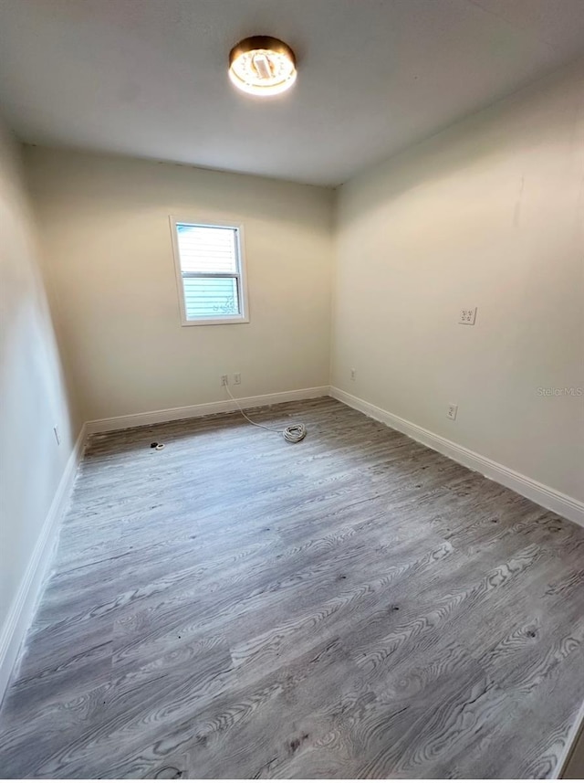 spare room with hardwood / wood-style floors