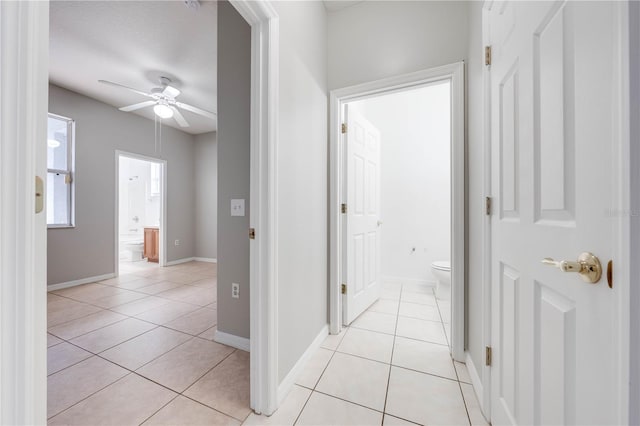 corridor featuring light tile patterned floors