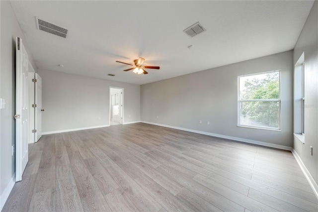 unfurnished room with ceiling fan and light hardwood / wood-style flooring