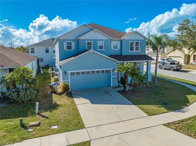 front of property featuring a front yard and a garage