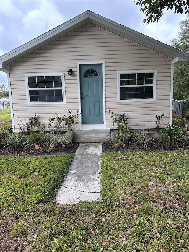 view of front of home with a front yard