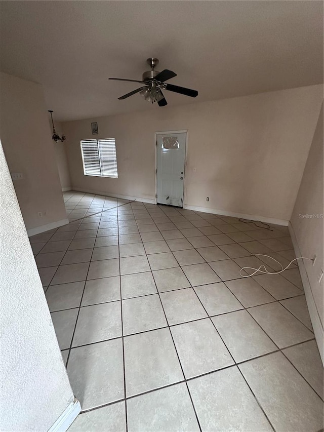 interior space with ceiling fan