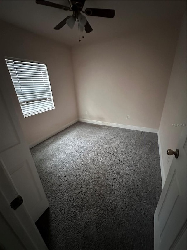 carpeted empty room with ceiling fan