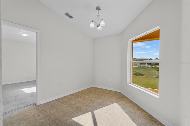 3362 Winchester Estates Cir, Lakeland, FL 33810 - spare room with a chandelier, tile patterned floors, and lofted ceiling