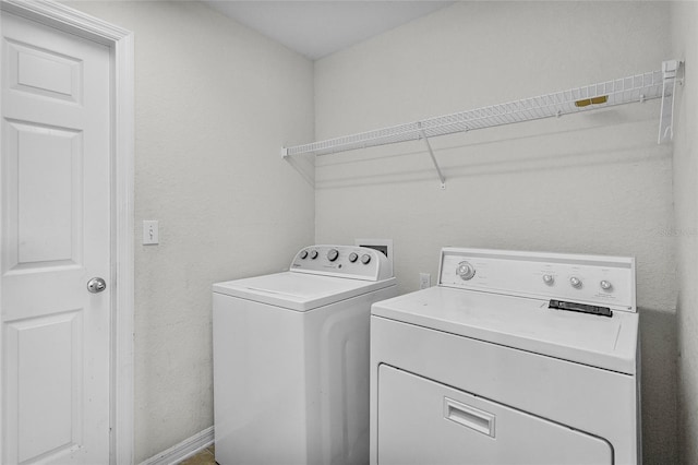 laundry room with independent washer and dryer