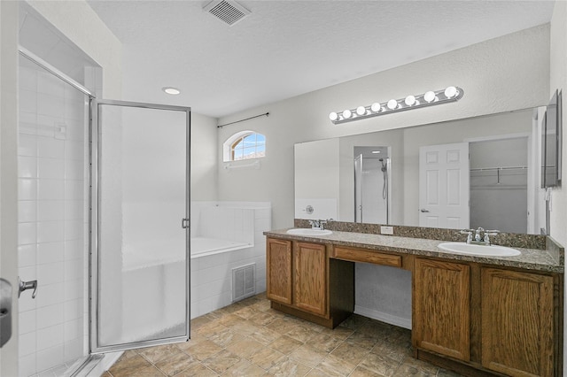 3362 Winchester Estates Cir, Lakeland, FL 33810 - bathroom with a stall shower, a bath, double vanity, and a walk in closet
