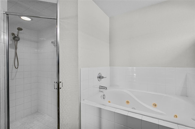 bathroom with separate shower and tub