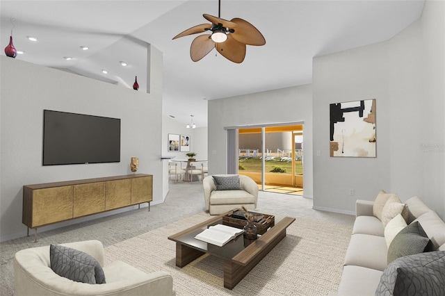 carpeted living room with high vaulted ceiling and ceiling fan