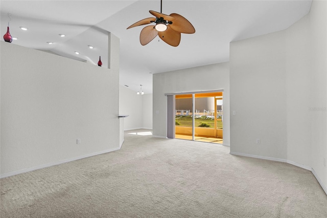 unfurnished room with ceiling fan, light carpet, and high vaulted ceiling