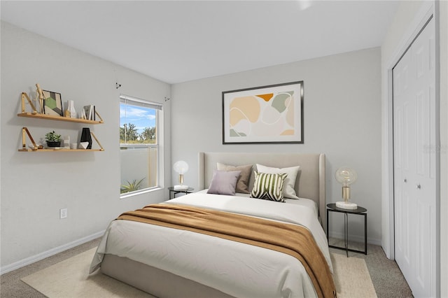 carpeted bedroom with a closet