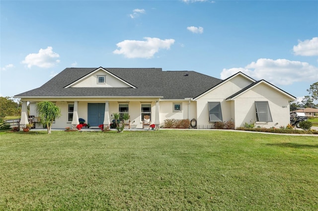 view of front of home with a porch and a front yard