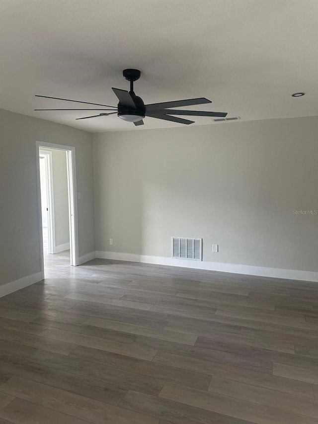 spare room with hardwood / wood-style floors