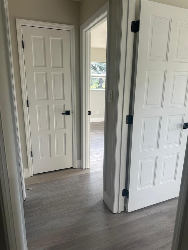 corridor featuring hardwood / wood-style floors