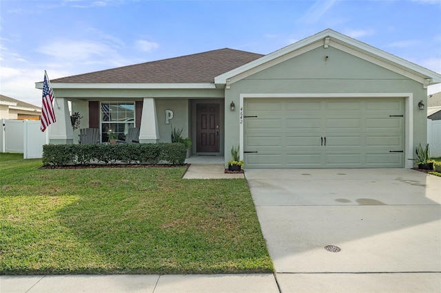 ranch-style home featuring a front yard and a garage