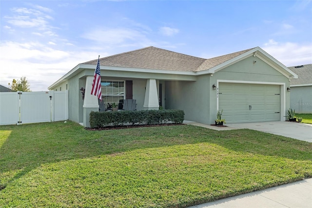 ranch-style house with a garage and a front lawn