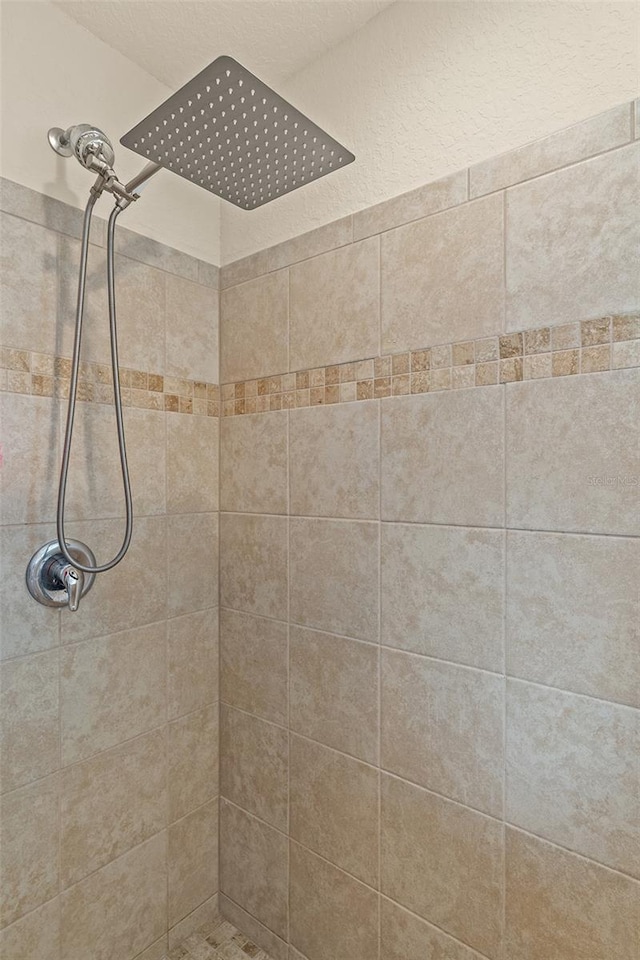 bathroom with a tile shower