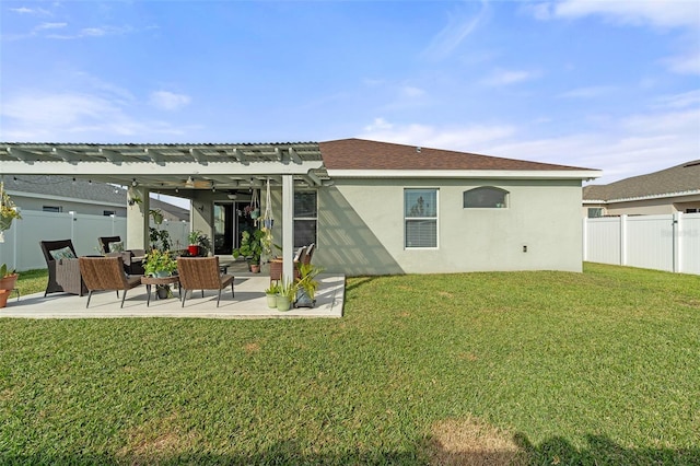 rear view of house with a pergola, a patio area, a yard, and an outdoor hangout area