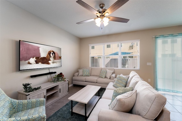 living room with light tile patterned floors and ceiling fan