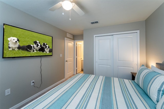 bedroom featuring ceiling fan and a closet