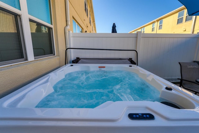 view of patio / terrace with a hot tub