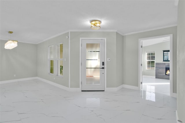 entrance foyer featuring a textured ceiling, vaulted ceiling, and ornamental molding