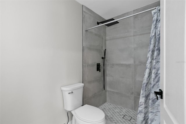 bathroom with toilet and walk in shower