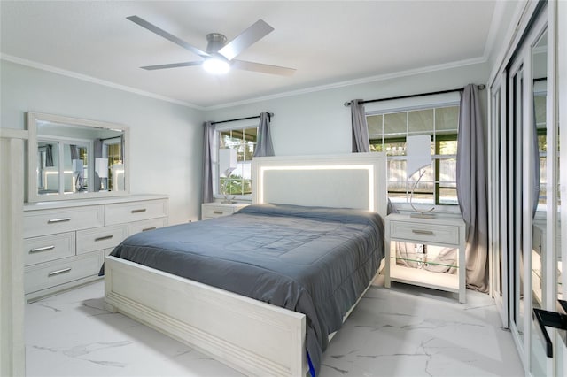 bedroom featuring ceiling fan and ornamental molding