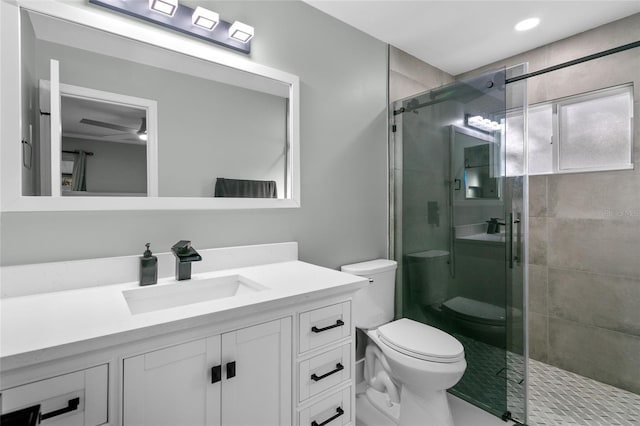 bathroom with vanity, toilet, and walk in shower