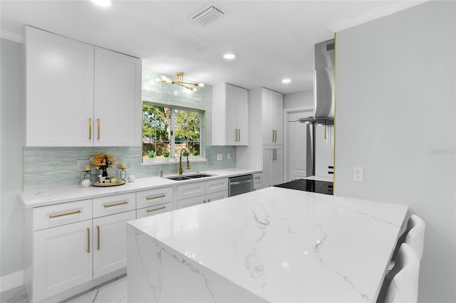 kitchen with dishwasher, light stone countertops, sink, and white cabinets