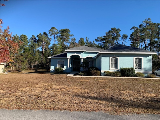 ranch-style house with a front yard