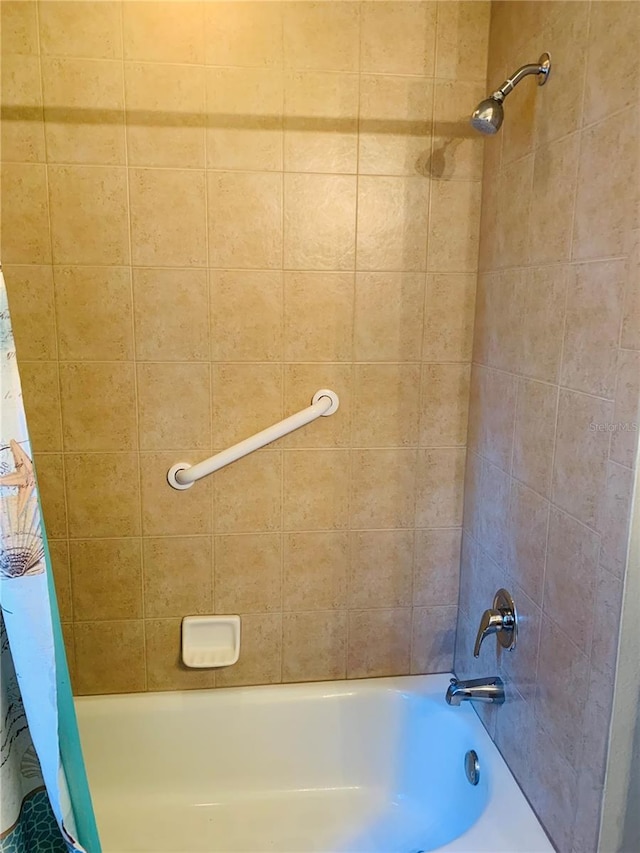 bathroom with shower / tub combo with curtain