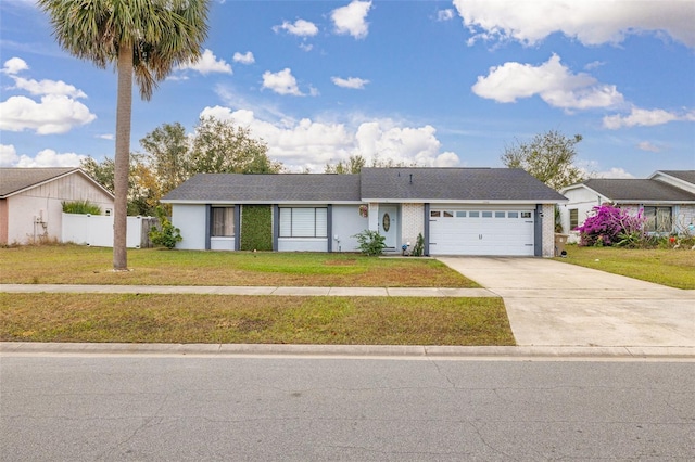 ranch-style house featuring a garage and a front lawn