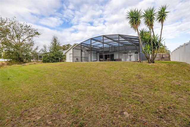 view of yard featuring glass enclosure