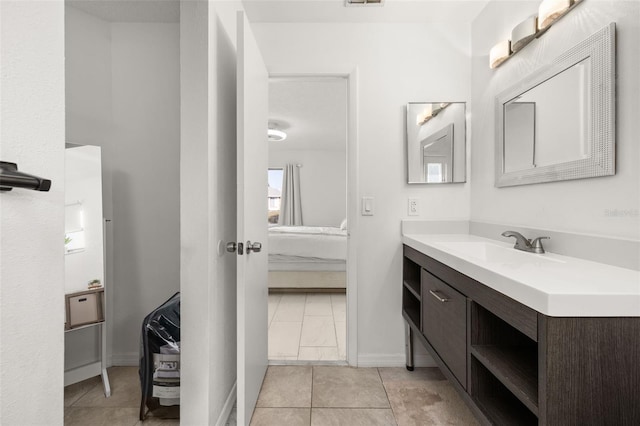 bathroom featuring tile patterned flooring and vanity