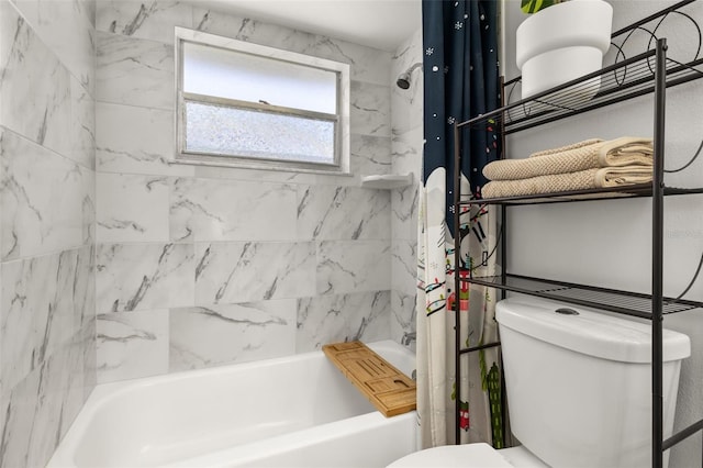 bathroom featuring shower / tub combo and toilet