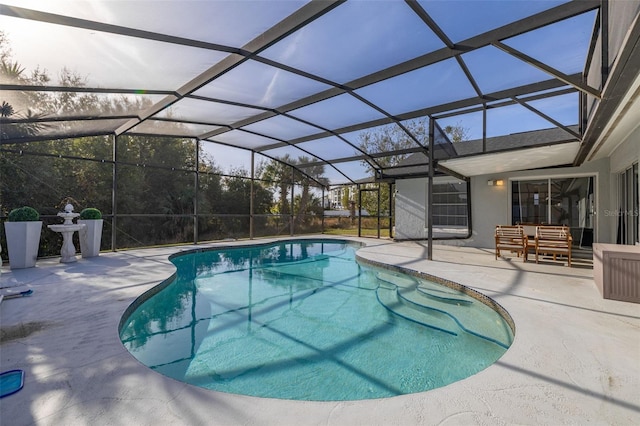 view of pool featuring a lanai and a patio