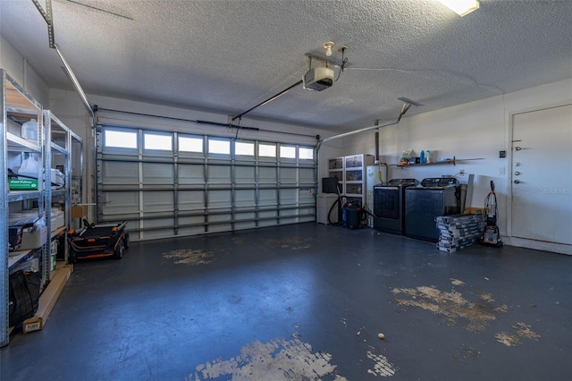 garage with washer and clothes dryer and a garage door opener