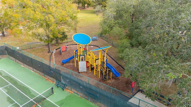 view of jungle gym featuring tennis court