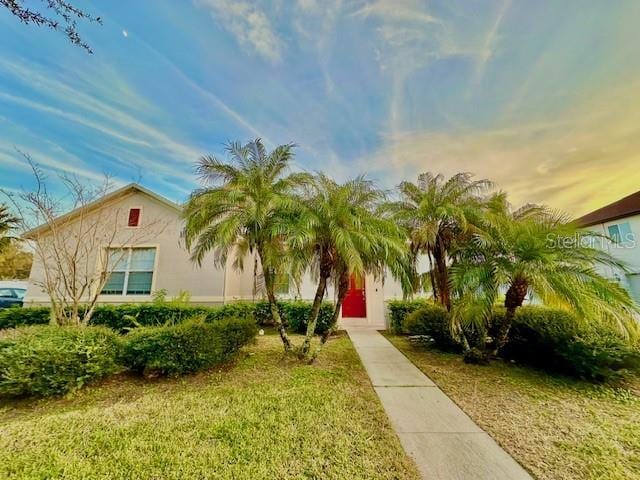 view of front of property with a lawn