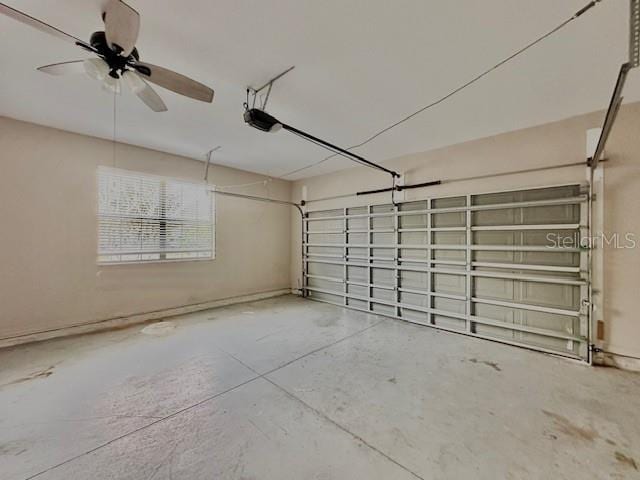 garage with ceiling fan and a garage door opener