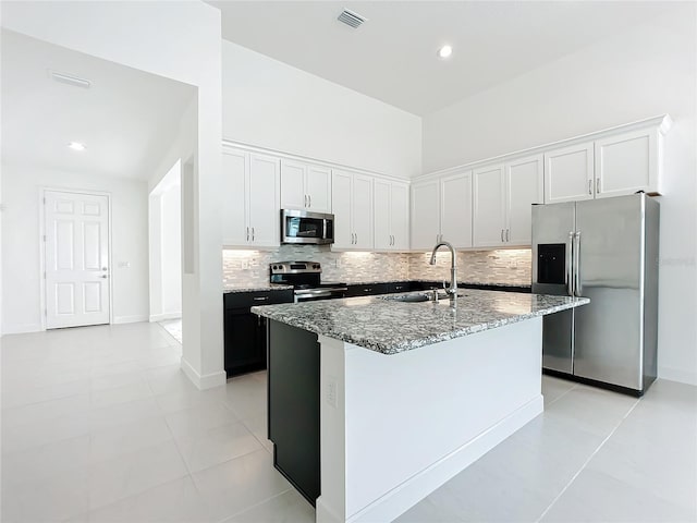 kitchen featuring a center island with sink, sink, white cabinetry, and stainless steel appliances