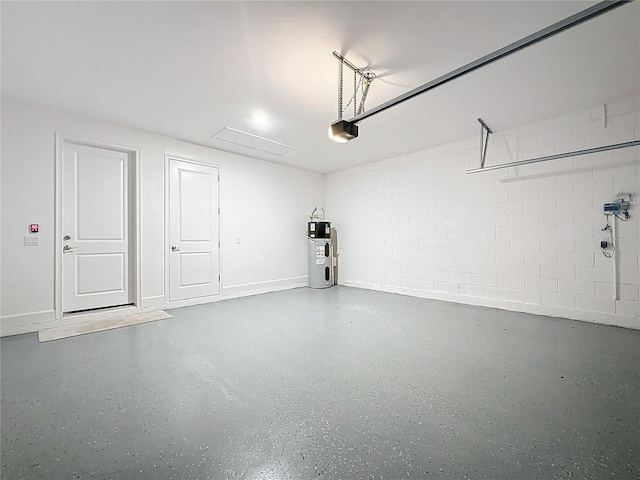 garage featuring a garage door opener and water heater