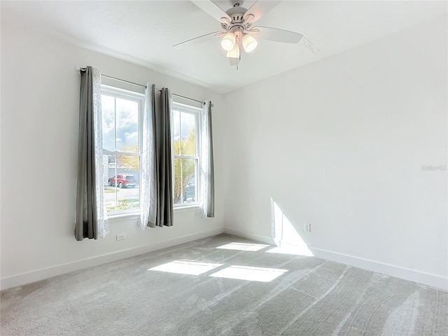 unfurnished room featuring carpet flooring and ceiling fan