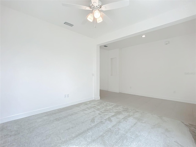 carpeted empty room featuring ceiling fan