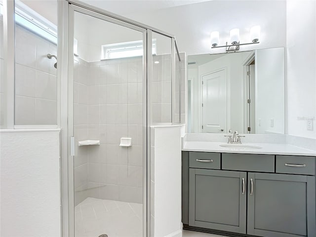 bathroom with vanity and walk in shower