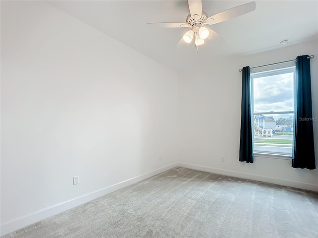 empty room featuring carpet flooring and ceiling fan