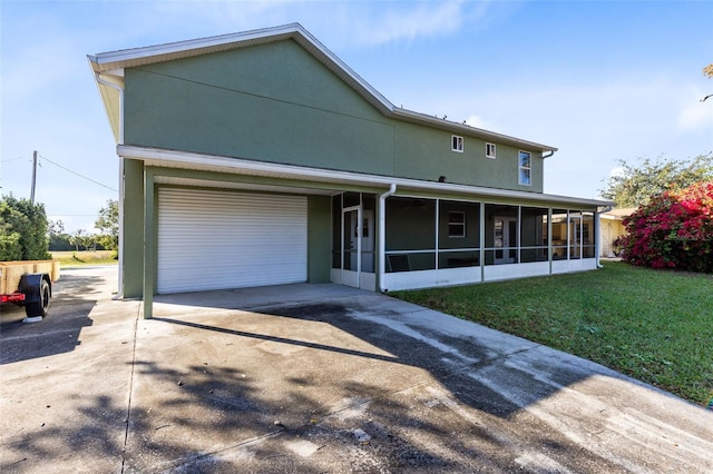 view of front of home with a sunroom and a front lawn