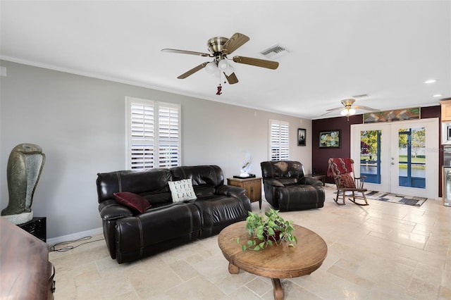 living room with ceiling fan, crown molding, and french doors